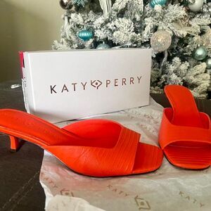 The Ladie Low Heel Sandal in orange. Size 12 Women's